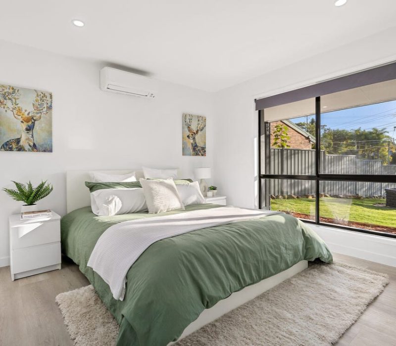 Bright bedroom with modern interior design and green tones