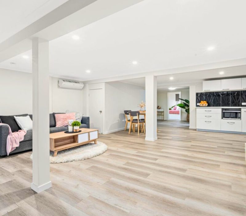 Open-plan interior living and dining space with modern flooring