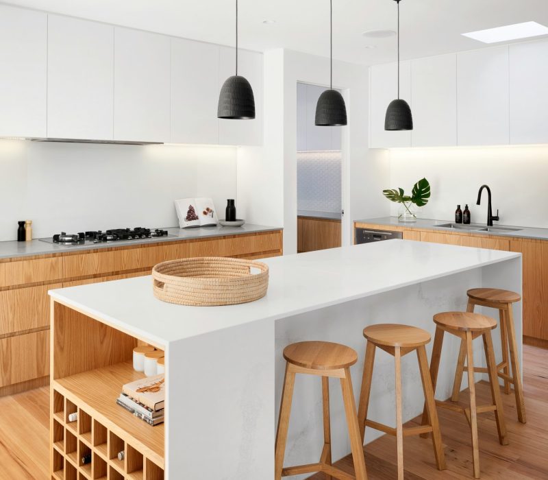 Modern kitchen with timber finishes, waterfall island and bar stools